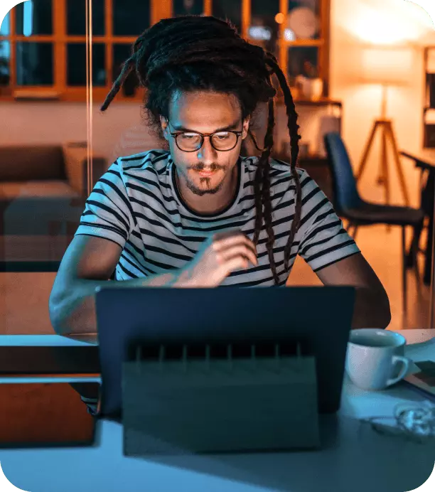 Man sitting at computer reading